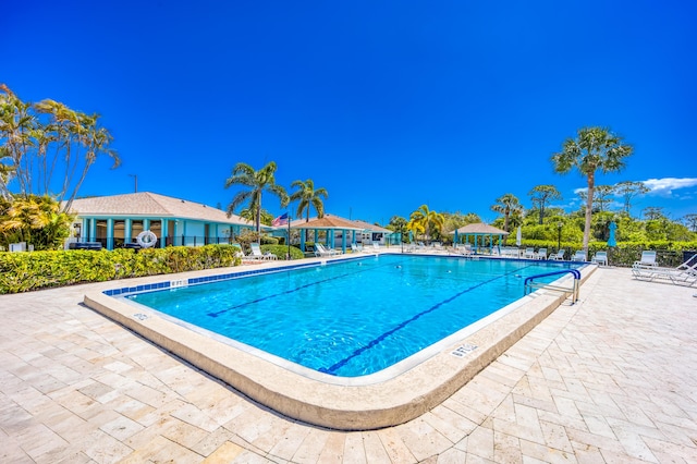 1501 NE 13th Ter Unit H-9, Jensen Beach, FL 34957 - community pool featuring a patio area