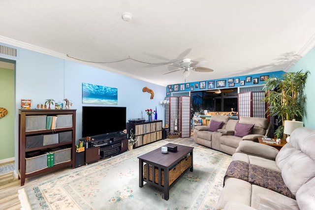 1501 NE 13th Ter Unit H-9, Jensen Beach, FL 34957 - living area with crown molding, ceiling fan, wood finished floors, and visible vents