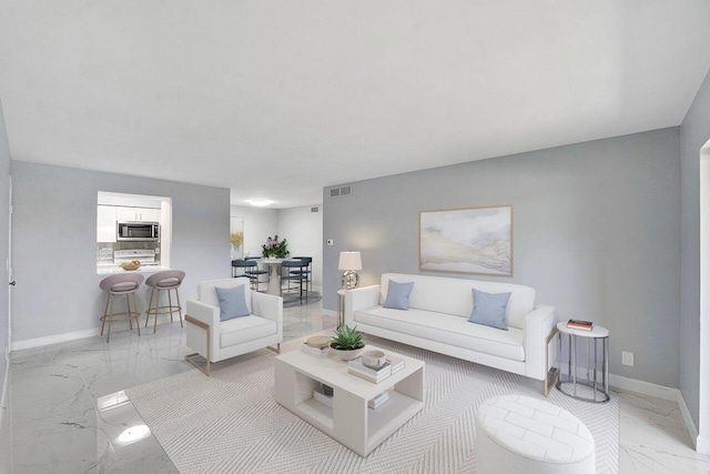 9960 Pineapple Tree Dr Unit 107, Boynton Beach, FL 33436 - living room featuring visible vents, marble finish floor, and baseboards