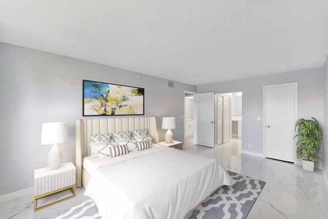 9960 Pineapple Tree Dr Unit 107, Boynton Beach, FL 33436 - bedroom with visible vents, marble finish floor, ensuite bathroom, and baseboards