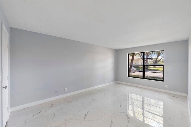 9960 Pineapple Tree Dr Unit 107, Boynton Beach, FL 33436 - empty room featuring baseboards and marble finish floor