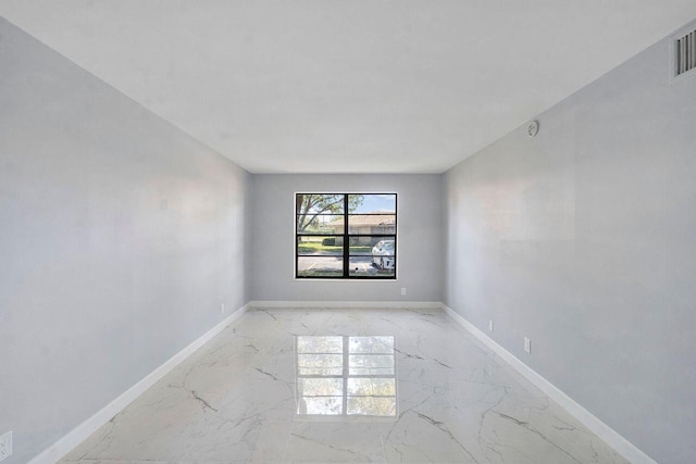 9960 Pineapple Tree Dr Unit 107, Boynton Beach, FL 33436 - spare room featuring baseboards and marble finish floor