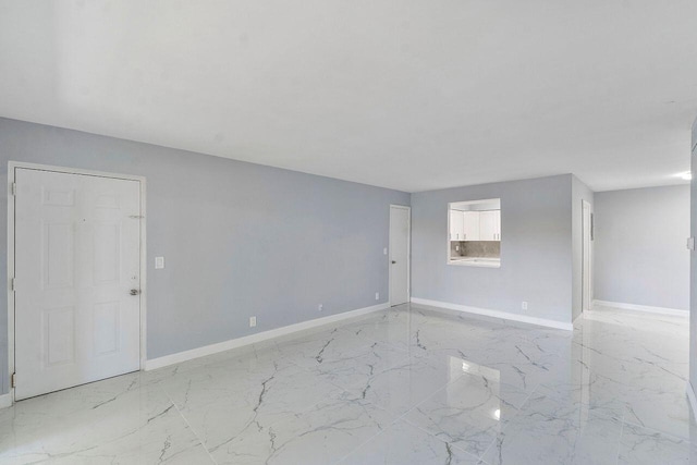 9960 Pineapple Tree Dr Unit 107, Boynton Beach, FL 33436 - unfurnished room with baseboards and marble finish floor