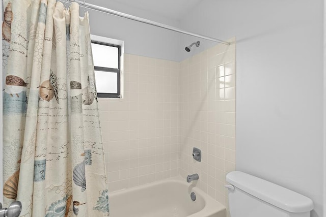full bathroom with toilet and shower / tub combo with curtain