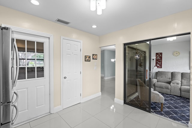 interior space with tile patterned floors, baseboards, recessed lighting, and visible vents