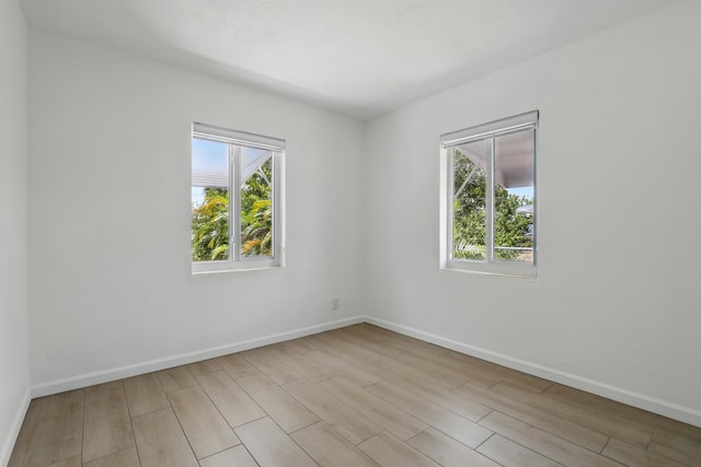 1225 15th Ave N, Lake Worth Beach, FL 33460 - empty room with wood finished floors and baseboards