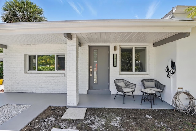1225 15th Ave N, Lake Worth Beach, FL 33460 - property entrance with brick siding and covered porch