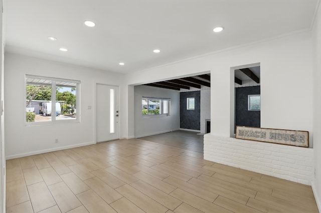 1225 15th Ave N, Lake Worth Beach, FL 33460 - unfurnished living room with recessed lighting, plenty of natural light, beamed ceiling, baseboards, and ornamental molding