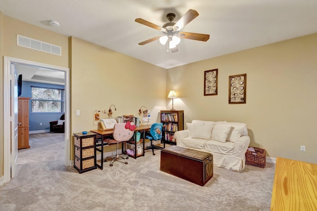 living room with carpet floors, ceiling fan, and baseboards