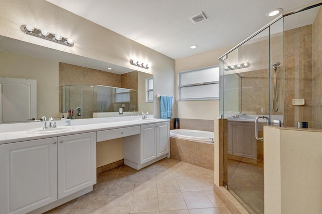 full bath with tile patterned flooring, a shower stall, a bath, double vanity, and recessed lighting