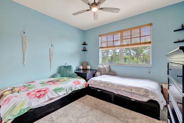 carpeted bedroom with a ceiling fan