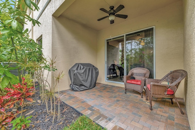 view of patio / terrace with a grill and a ceiling fan