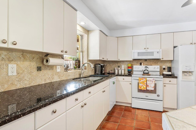 2701 SW 4th St, Boynton Beach, FL 33435 - kitchen featuring a sink, decorative backsplash, white cabinets, and white appliances