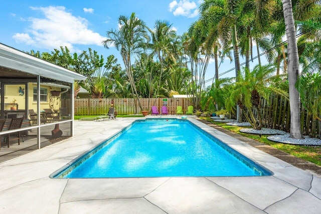 2701 SW 4th St, Boynton Beach, FL 33435 - view of swimming pool with a patio, a fenced backyard, a sunroom, and a fenced in pool