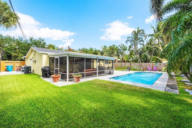 2701 SW 4th St, Boynton Beach, FL 33435 - view of pool with a yard, cooling unit, a fenced backyard, and a sunroom