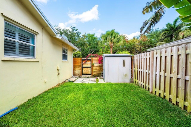2701 SW 4th St, Boynton Beach, FL 33435 - view of yard with a fenced backyard, a gate, an outdoor structure, and a shed