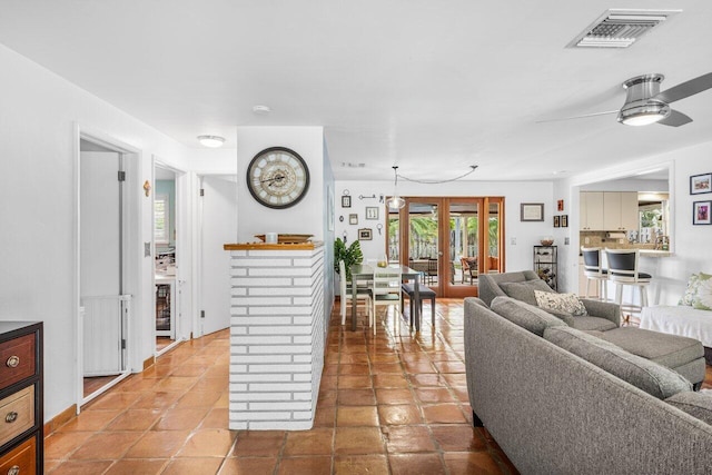 2701 SW 4th St, Boynton Beach, FL 33435 - tiled living area with visible vents and a ceiling fan
