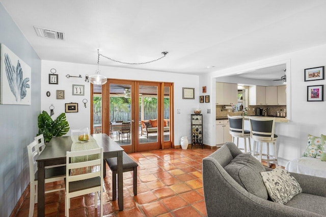 2701 SW 4th St, Boynton Beach, FL 33435 - living area featuring french doors, plenty of natural light, visible vents, and ceiling fan