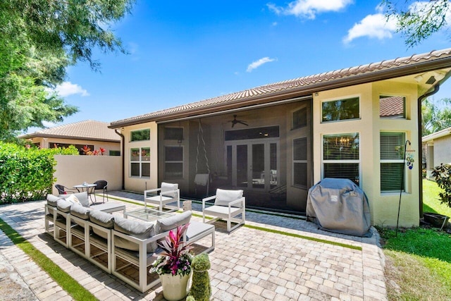 8673 Carmel Mountain Way, Boynton Beach, FL 33473 - back of house featuring a patio area, stucco siding, an outdoor hangout area, a ceiling fan, and a tiled roof