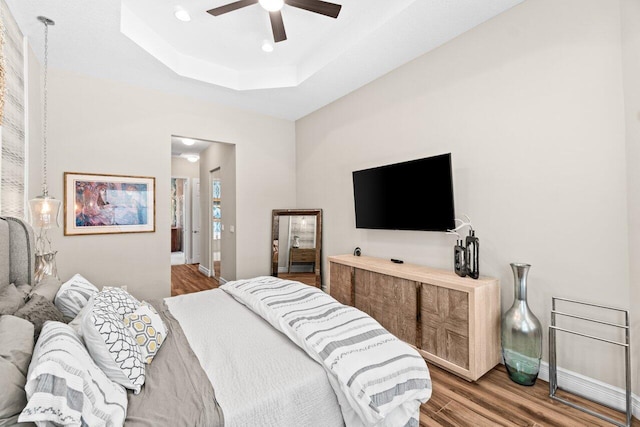 8673 Carmel Mountain Way, Boynton Beach, FL 33473 - bedroom featuring wood finished floors, baseboards, recessed lighting, a tray ceiling, and ceiling fan