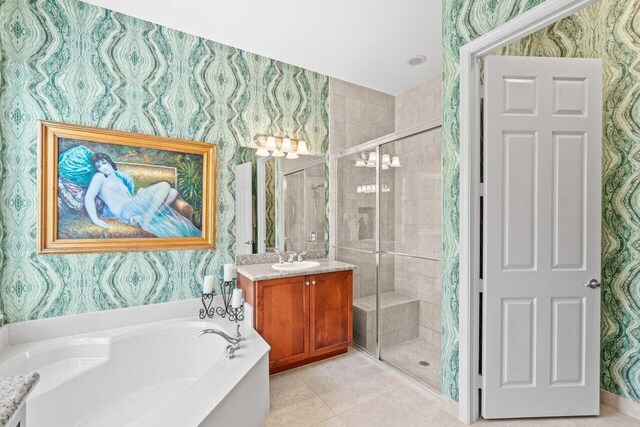 8673 Carmel Mountain Way, Boynton Beach, FL 33473 - bathroom with wallpapered walls, vanity, a garden tub, a shower stall, and tile patterned floors