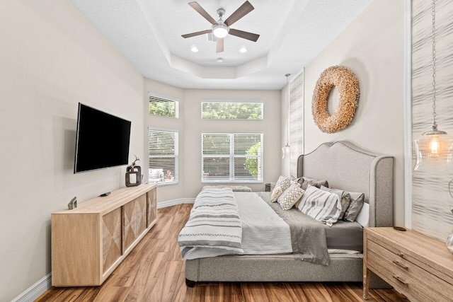 8673 Carmel Mountain Way, Boynton Beach, FL 33473 - bedroom featuring wood finished floors, baseboards, a raised ceiling, and recessed lighting