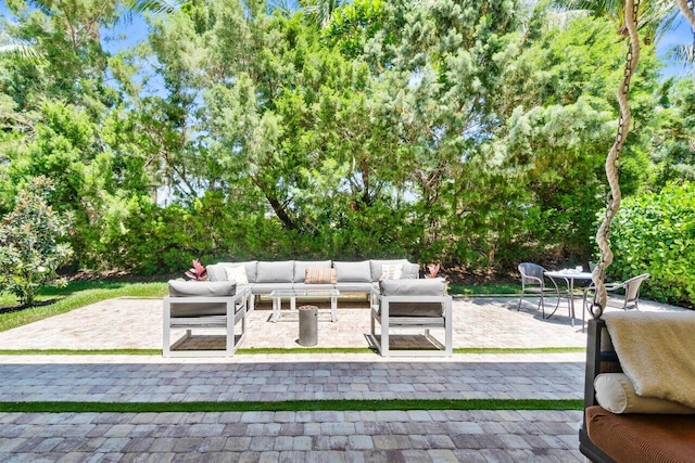 8673 Carmel Mountain Way, Boynton Beach, FL 33473 - view of patio / terrace featuring outdoor lounge area and view of scattered trees