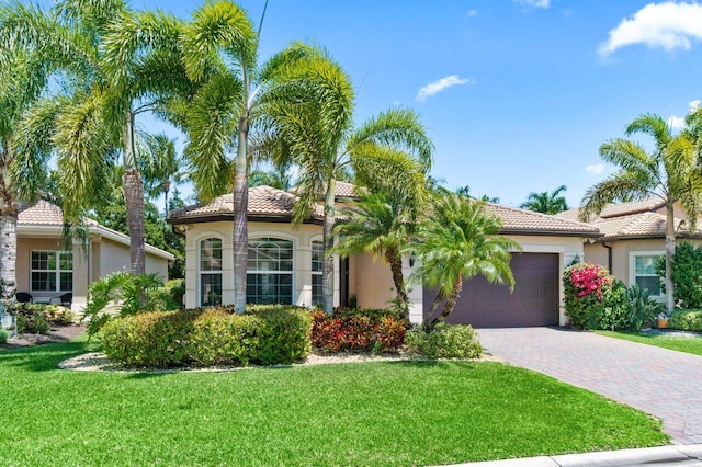 8673 Carmel Mountain Way, Boynton Beach, FL 33473 - mediterranean / spanish home featuring stucco siding, a tiled roof, and a garage