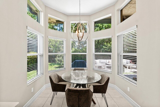 8673 Carmel Mountain Way, Boynton Beach, FL 33473 - dining room with a chandelier, light tile patterned flooring, baseboards, and a towering ceiling