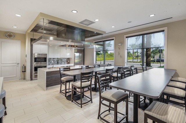 8673 Carmel Mountain Way, Boynton Beach, FL 33473 - dining space with recessed lighting and ornamental molding