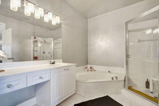 full bath with a shower stall, a garden tub, vanity, and tile patterned floors