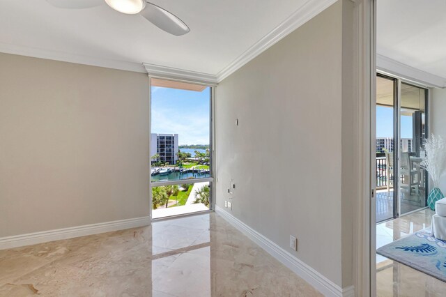 2707 N Ocean Blvd Unit D506, Boca Raton, FL 33431 - empty room with a wall of windows, marble finish floor, baseboards, a water view, and ornamental molding