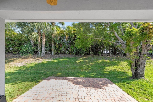 846 SW Rocky Bayou Ter, Port Saint Lucie, FL 34986 - view of grassy yard featuring a patio