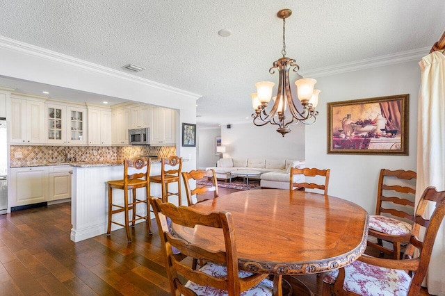 3980 Quail Ridge Dr Egret, Unit Egret, Boynton Beach, FL 33436 - dining space with a notable chandelier, dark wood-type flooring, a textured ceiling, and visible vents