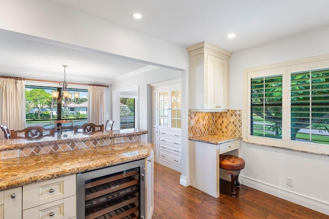 3980 Quail Ridge Dr Egret, Unit Egret, Boynton Beach, FL 33436 - bar featuring backsplash, pendant lighting, dark wood-style floors, a notable chandelier, and wine cooler