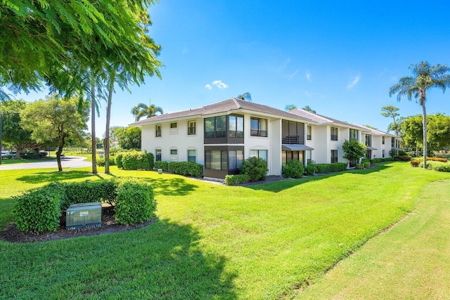 3980 Quail Ridge Dr Egret, Unit Egret, Boynton Beach, FL 33436 - back of property featuring a lawn and stucco siding