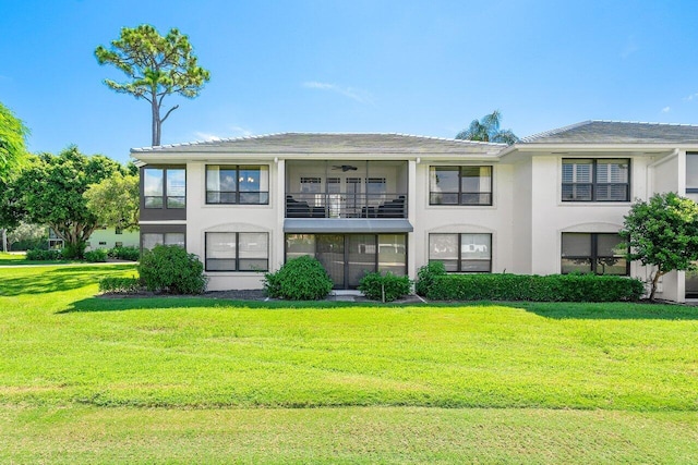 3980 Quail Ridge Dr Egret, Unit Egret, Boynton Beach, FL 33436 - rear view of property with a lawn, stucco siding, and a balcony