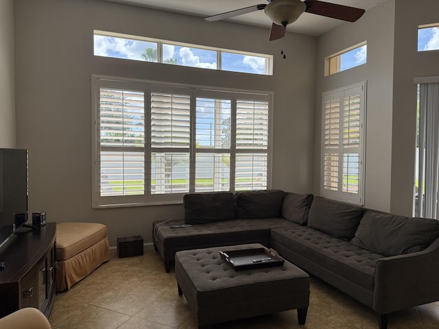 212 NW Pleasant Grove Way, Port Saint Lucie, FL 34986 - living area featuring a ceiling fan, light tile patterned floors, and a high ceiling