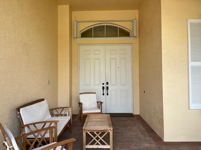 property entrance featuring stucco siding