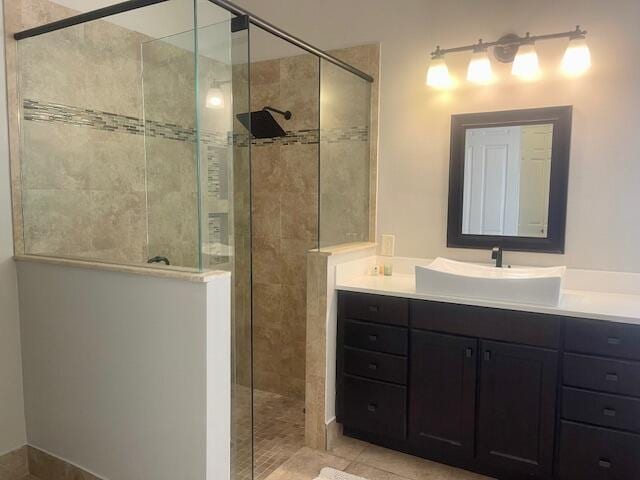 212 NW Pleasant Grove Way, Port Saint Lucie, FL 34986 - full bath featuring a tile shower, vanity, and tile patterned floors