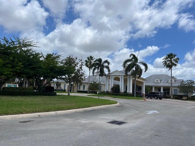 mediterranean / spanish home featuring a front yard