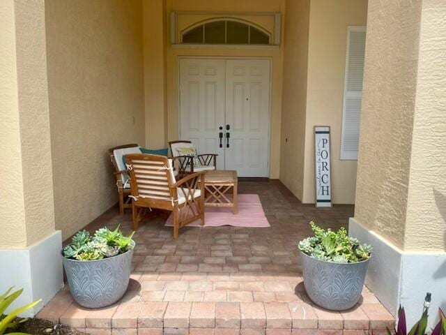 212 NW Pleasant Grove Way, Port Saint Lucie, FL 34986 - view of exterior entry with stucco siding