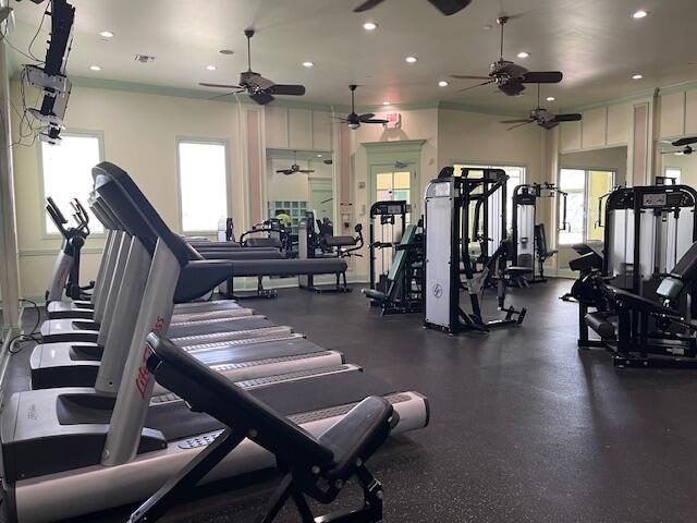 workout area featuring a ceiling fan, recessed lighting, and a wealth of natural light