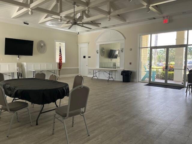 212 NW Pleasant Grove Way, Port Saint Lucie, FL 34986 - dining area with coffered ceiling, beamed ceiling, healthy amount of natural light, wood finished floors, and ornamental molding