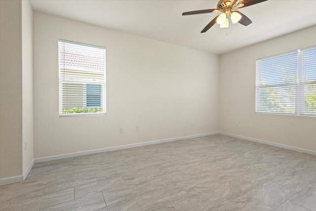 12133 SW Aventino Dr, Port Saint Lucie, FL 34987 - empty room featuring a ceiling fan and baseboards