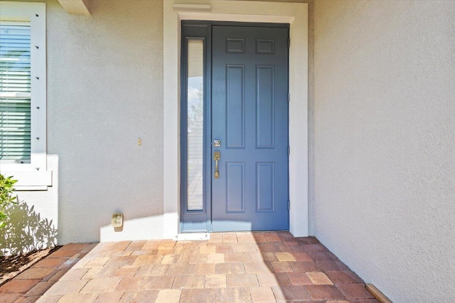 12133 SW Aventino Dr, Port Saint Lucie, FL 34987 - entrance to property featuring stucco siding