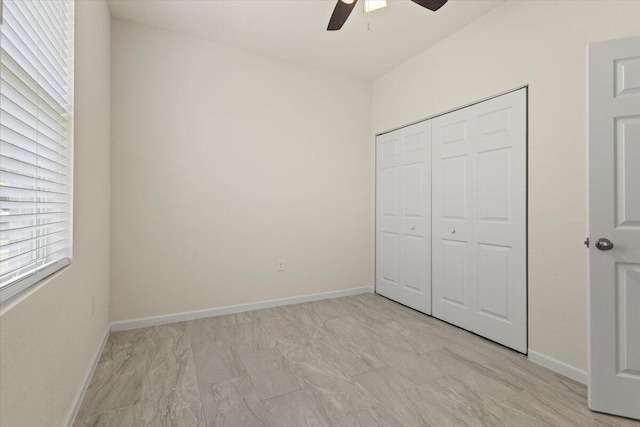 12133 SW Aventino Dr, Port Saint Lucie, FL 34987 - unfurnished bedroom with a closet, a ceiling fan, and baseboards