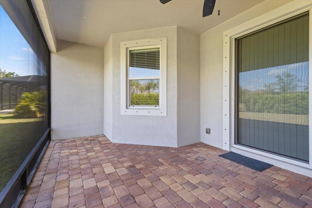 12133 SW Aventino Dr, Port Saint Lucie, FL 34987 - entrance to property featuring ceiling fan and stucco siding