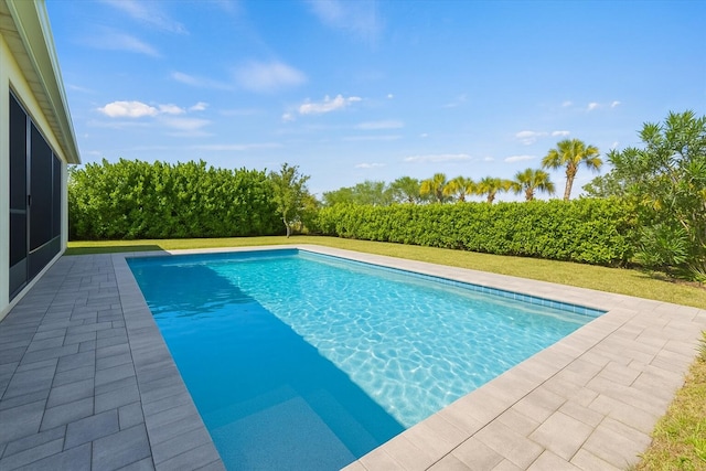 12133 SW Aventino Dr, Port Saint Lucie, FL 34987 - swimming pool featuring a patio and a lawn