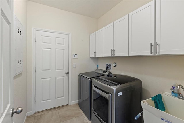 12133 SW Aventino Dr, Port Saint Lucie, FL 34987 - washroom with independent washer and dryer, cabinet space, and baseboards